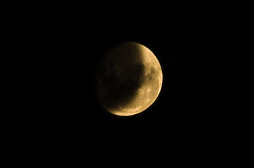 Beautiful photo of the waning moon in close up with dark sky in the background.