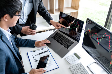 Poster - Business team partner working with computer, laptop, discussion and analyzing graph stock market trading with stock chart data planning, financial and investment concept