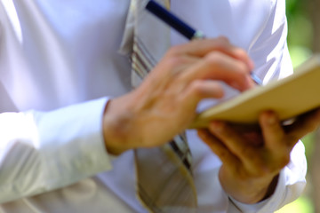 Poster - businessman writing on a notebook and successful planning