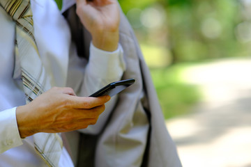 Sticker - close up businessman using a smartphone and space for text