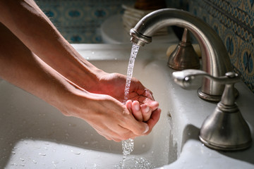 Wall Mural - washing hands with water