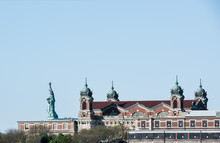 Side View Of Statue Of Liberty And The Exterior Of Ellis Island On The Hudson River, Taken From The Liberty State Park.
