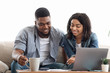 © Prostock-studio - Young african american couple planning budget together at home, writing notes to notebook, creating checklist for shopping or guest list for wedding