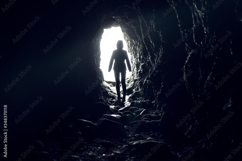 Silhouette Woman Standing In Cave - obrazy, fototapety, plakaty 