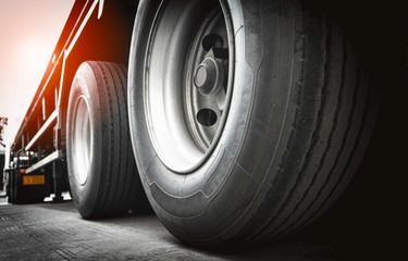 close up truck wheels, semi truck trailer on parking, road freight transport