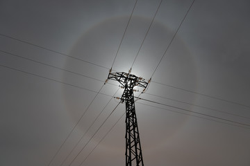 electric tower with full moon halo