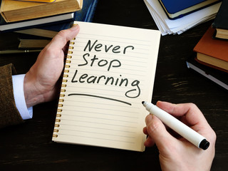 Wall Mural - Never stop learning written by man phrase.
