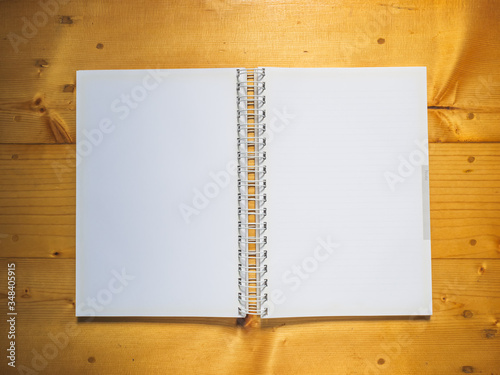 Top view, School notebook on wooden background, Notebook on a table © touch_of_eyes