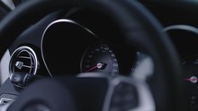 Detail Shot Of A Speedometer In A Car With Black Interieur Going From Zero To Full Speed When The Car Is Turned On.