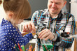 © H_Ko - Man and little girl play with colourful liquids