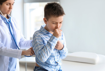 Sticker - Ill coughing little boy visiting doctor in clinic