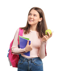 Wall Mural - Pupil with apple on white background