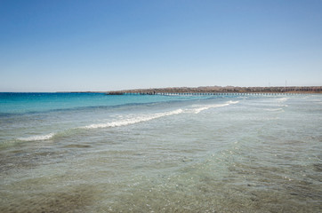 Empty beach on the sea and sunny sky/Empty summer beach on the sea and sunny sky