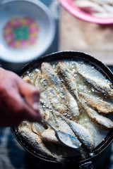 Wall Mural - Frying small sardines fish, Chefchouen, Morocco