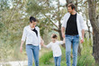 © Serhii - Dad, mom and little son having fun together, outdoors. Family walk in park. Happy family outdoors. Family, vacation concept