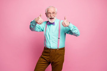 Canvas Print - Portrait of positive cheerful old man promoter show thumb-up sign suggest select ads promotion wear turquoise pants isolated pastel pink color background