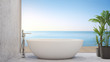 White bathtub on marble floor near terrace of infinity pool in modern beach house or luxury villa. Elegance home interior 3d rendering with sky and sea view.
