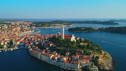 Wall Mural - Aerial view from Rovinj historic old beautiful town and Rovinj port and boats under beautiful blue sky aerial view, Croatia	
