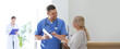 © New Africa - Doctor talking with patient in hospital hall. Banner design