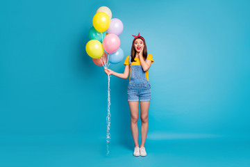 Poster - Full length body size view of her she nice attractive cheerful glad girl holding in hand colorful balls festive isolated on bright vivid shine vibrant blue green teal turquoise color background