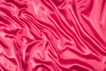 bright pink, cerise silk folded fabric background
