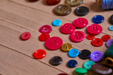 Poster - Background and texture of multicolored antique buttons and sewing tools