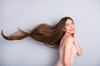 © deagreez - Profile photo of attractive cute model lady demonstrating ideal neat long healthy hairstyle flying on air after lamination procedure wear beige singlet isolated grey color background