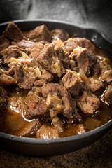 Canvas Print - Beef stew in a cast iron skillet.