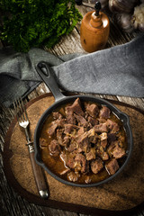 Canvas Print - Beef stew in a cast iron skillet.