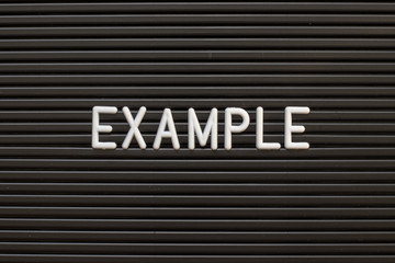 Wall Mural - black color felt letter board with white alphabet in word example background