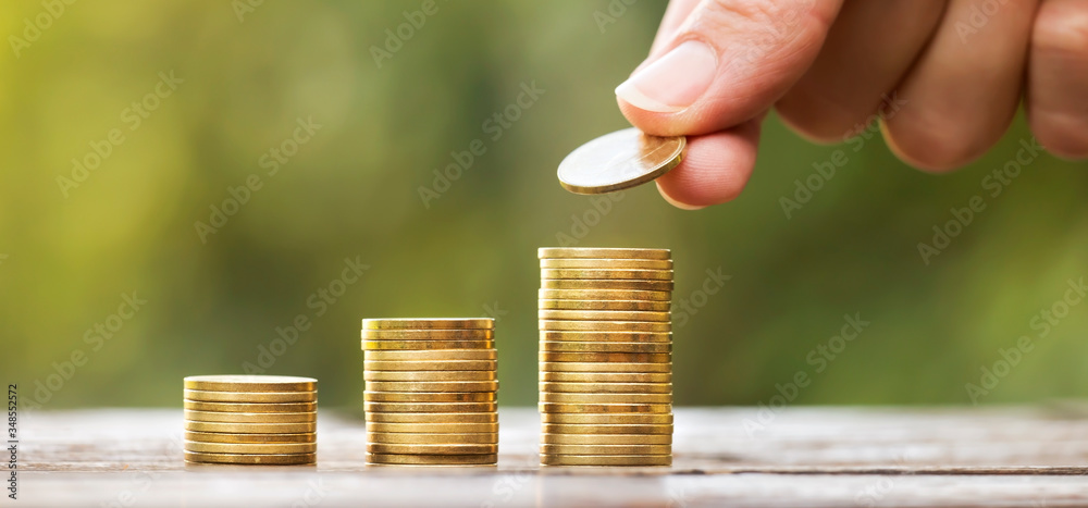 Growing gold money coins and hand, financial services concept, web banner with copy space - obrazy, fototapety, plakaty 