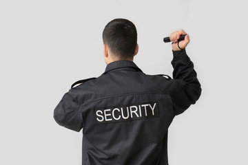 Sticker - Male security guard with flashlight on grey background