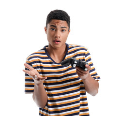 Poster - African-American teenage boy playing video game on white background