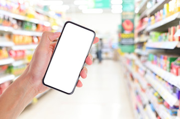 Poster - Man hand holding smartphone in supermarket ,Empty white screen smartphone for design advertising on mobile phone screen ezy replace with clipping path