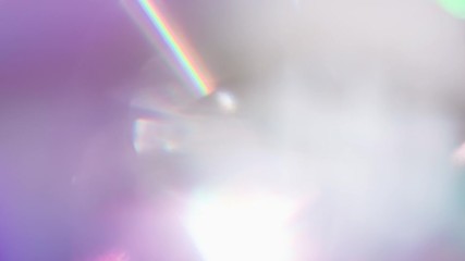 optical refraction in violet tones. loop. the light passes through the facets of a slowly rotating d