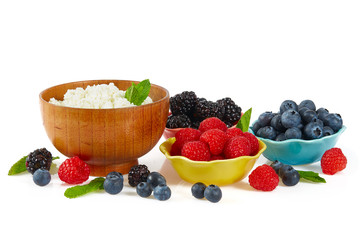 Wall Mural - fresh cottage cheese and berries isolated on white