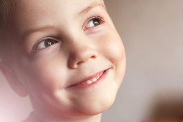 Portrait of a cheerful funny boy so close