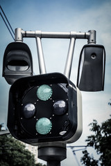 Green color on the traffic light with a beautiful blue sky in background in city