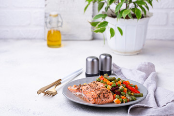 Wall Mural - Baked salmon with boiled vegetable