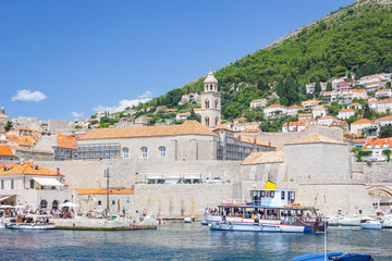 Wall Mural - Panorama of Dubrovnik - view from sea with blue water of old town and harbor with yachts and boats, Dubrovnik, Croatia.