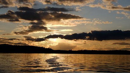 Canvas Print - lake at sunset with  ripples on the water