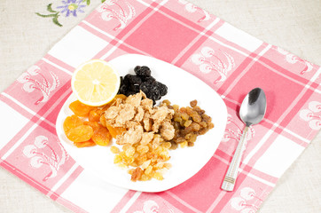 Wall Mural - close up of dried fruits on plate at kitchen