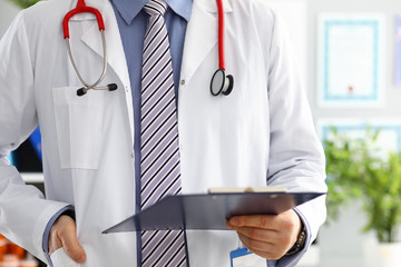 Sticker - Stethoscope lying on male doctor chest in office