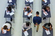 © Chris Ryan/Caia Image - High school teacher supervising students taking exam at desks