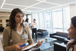 © Martin Barraud/Caia Image - Female doctors talking in office