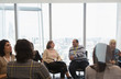 © Martin Barraud/Caia Image - Business people talking in circle in conference room meeting