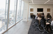© Tom Merton/Caia Image - Business people talking in urban conference room meeting