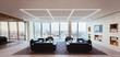 © Robert Daly/Caia Image - Sofas in modern urban highrise office lounge