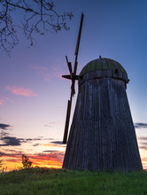 Silhouette Of Wooden Wind Mill In Sunset Sky With Copy Space In Ukraine