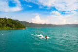Couple practicing water sports on the lake of Coatepeque in El Salvador, Central America